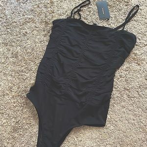 Womens black sheer body suit w/ ruffle detail on front- Size LG- new with tags!